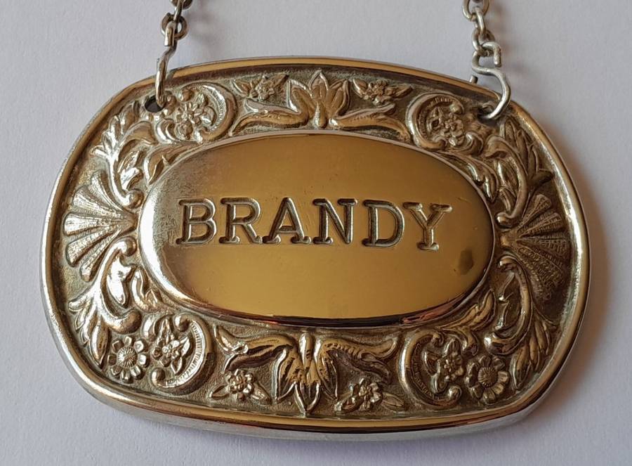 A Vintage Silver Plated `BRANDY` Bottle Decanter Label By `Ianthe, England`.