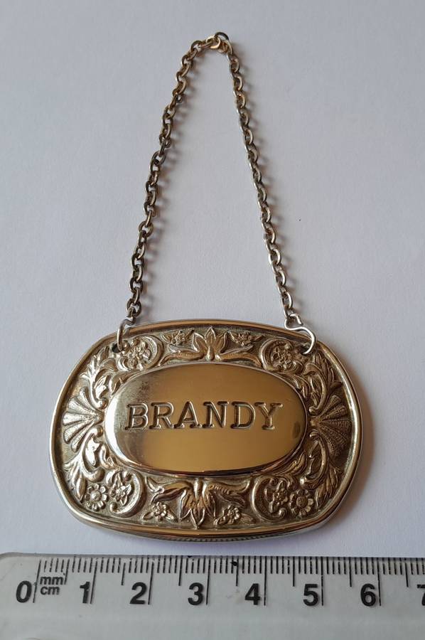 A Vintage Silver Plated `BRANDY` Bottle Decanter Label By `Ianthe, England`.