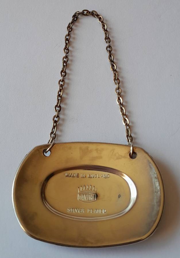 A Vintage Silver Plated `WINE` Bottle Decanter Label By `Ianthe, England`. (2 of 2)