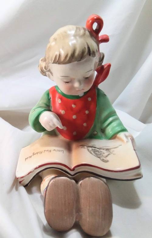 Two beautiful Hummel style little girls reading - Bookends