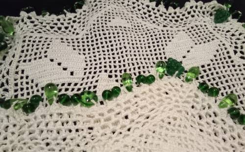 White Vintage crocheted jug cover with green glass beads