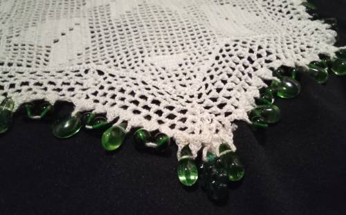 White Vintage crocheted jug cover with green glass beads