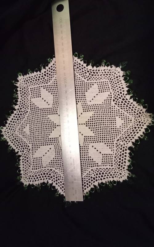 White Vintage crocheted jug cover with green glass beads