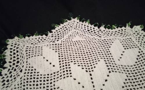 White Vintage crocheted jug cover with green glass beads