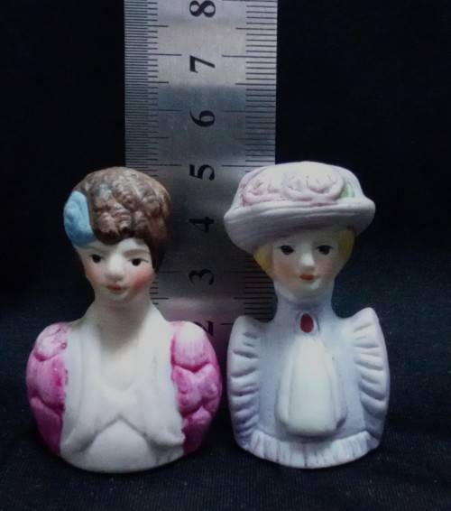 Two Avon thimbles