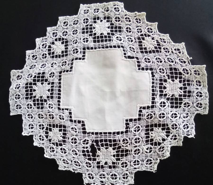 Very interesting crocheted white doily