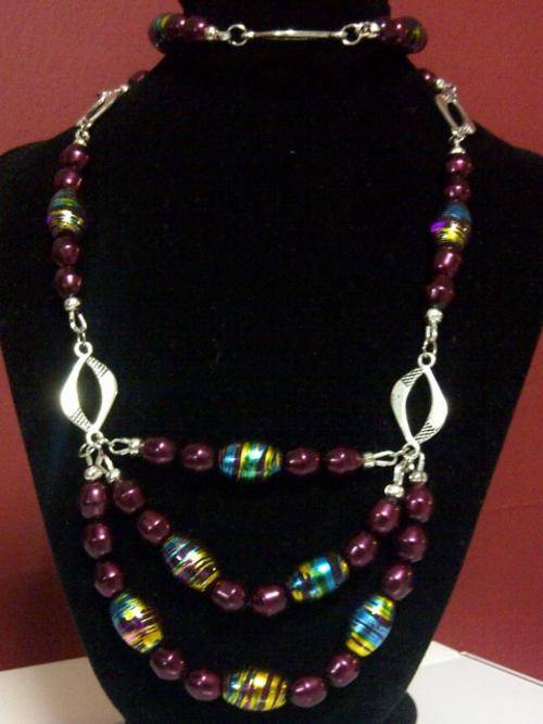 Over the neck long purple and blue necklace