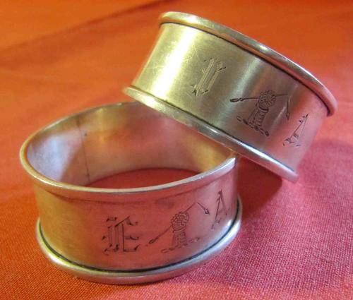 Pair of Hallmarked Silver Serviette Rings with Engraving of a Clenched Fist holding a Broken Arrow