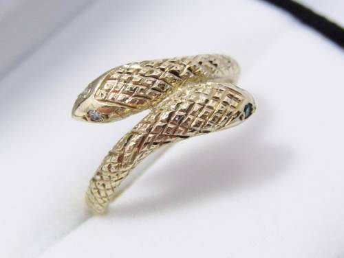 Antique design 9 carat gold ring with a double snake head