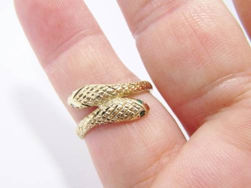 Antique design 9 carat gold ring with a double snake head