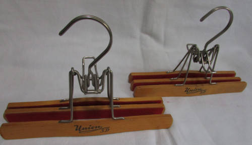 2 Wooden Trouser Hangers holding 2 pairs of Trousers
