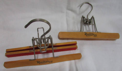 2 Wooden Trouser Hangers holding 2 pairs of Trousers