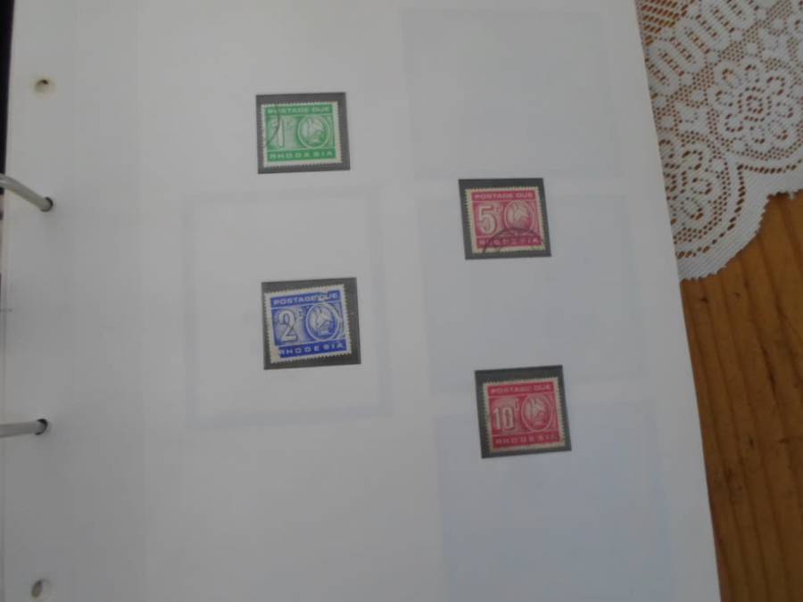 FILE RHODESIA MINT STAMPS ONLY SOME PAGES SCANNED SEE PICS