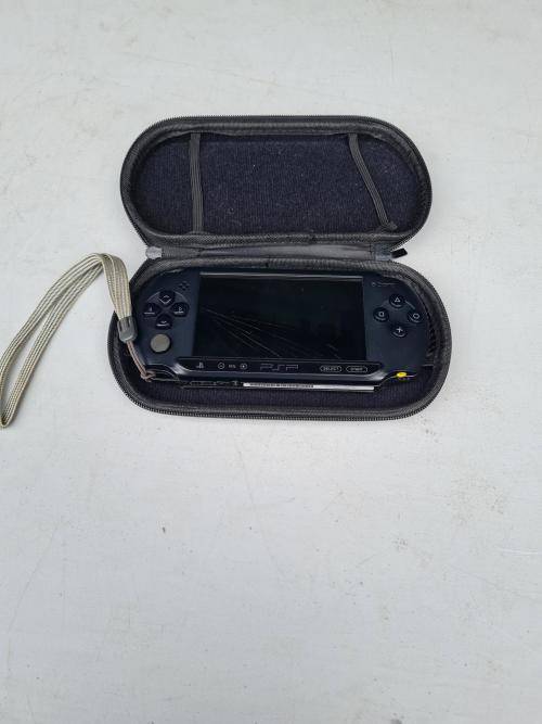 ORIGINAL SONY PSP WITH ORIGINAL CHARGER AND CASING - SCREEN CRACKED AND NOT SWITCHING ON