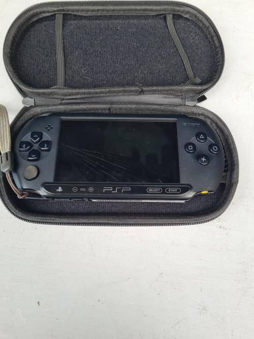 ORIGINAL SONY PSP WITH ORIGINAL CHARGER AND CASING - SCREEN CRACKED AND NOT SWITCHING ON