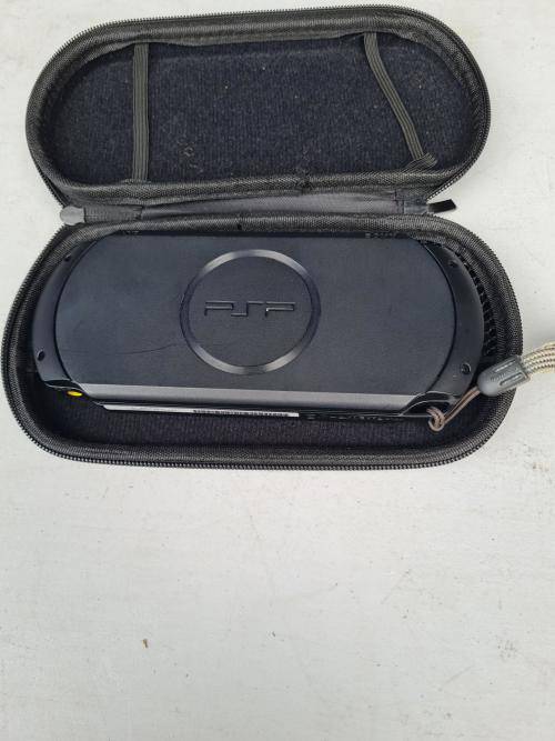 ORIGINAL SONY PSP WITH ORIGINAL CHARGER AND CASING - SCREEN CRACKED AND NOT SWITCHING ON