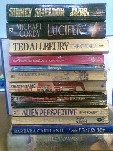 LOT OF 12  USED BOOKS STILL IN GOOD CONDITION