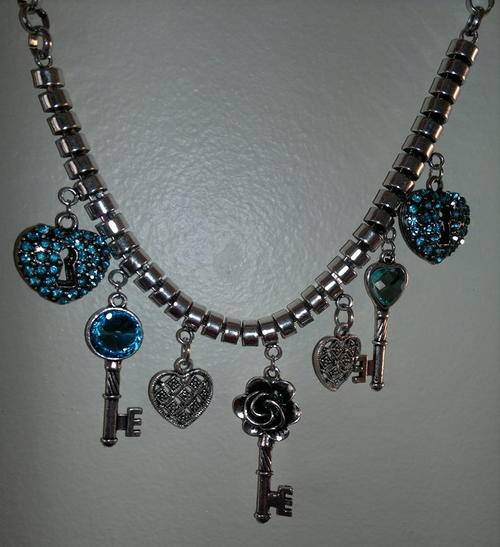 Absolute gorgeous light blue and silver charm necklace