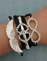***BRAND NEW CRYSTALS INFINITY BRACELET BLACK AND SILVER WINGS ***