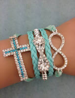 Infinity Glitter Blue Cross Bracelet