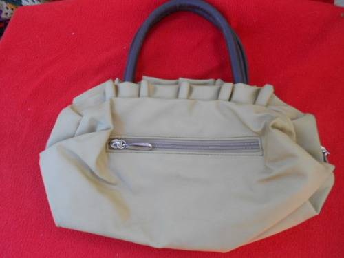 Light brown handbag.  Gill design