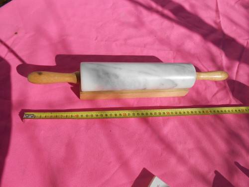 Marble rolling pin with it`s own stand. It is heavy.