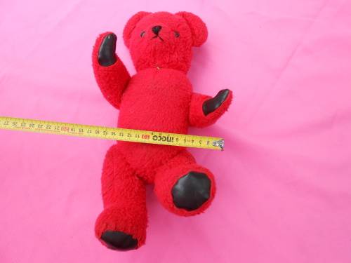 Red `Reindeer` label teddy bear.  Made in South Africa. 400mm high. Hole in right paw and foot.