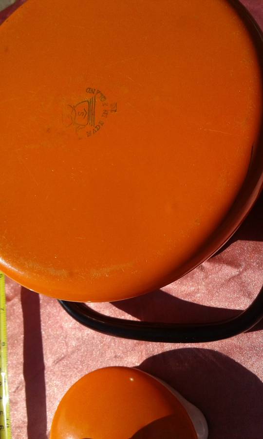 Enamel,  orange-coloured kettle.  Made in Poland.