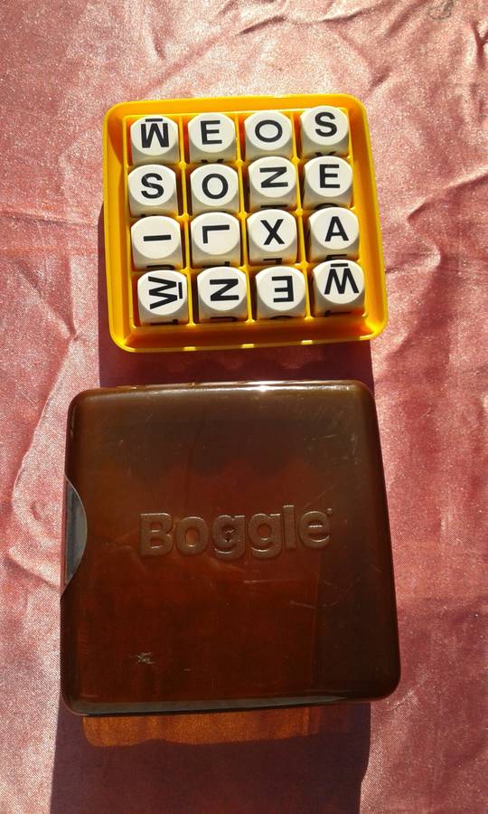 Boggle.  A hidden word game.  2 to 6 players.  Ages 8 to adult.