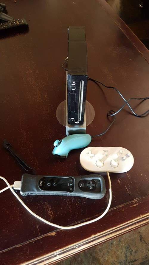 Nintendo Wii black console with Mario Bros and Islander loaded