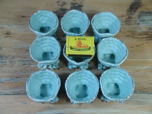 A set of 9 Vintage porcelain Egg Cups, blue with gold trim, excellent condition