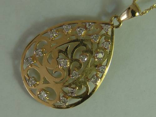 10ct Yellow gold teardrop pendant with 18 natural diamonds on a 9ct yellow gold chain