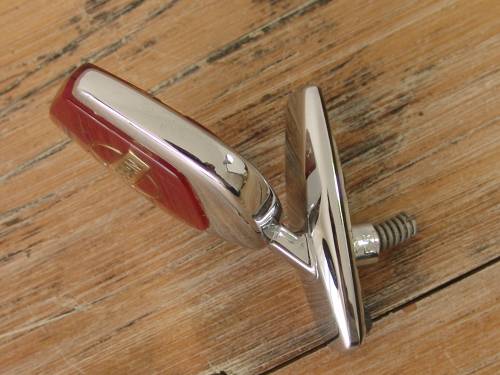 Vintage Nissan chrome car mascot, to open hood.