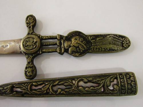 Vintage metal paper knife in the shape of a sword / dagger