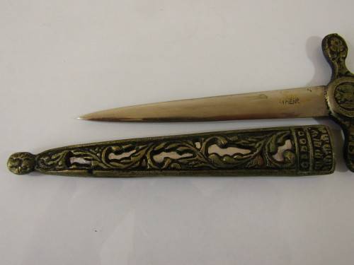 Vintage metal paper knife in the shape of a sword / dagger
