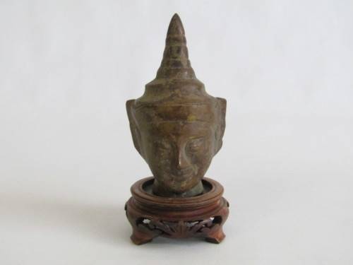 Very old Burmese Bronze Buddha Head on wooden Stand in excellent and aged condition, 13cm tall