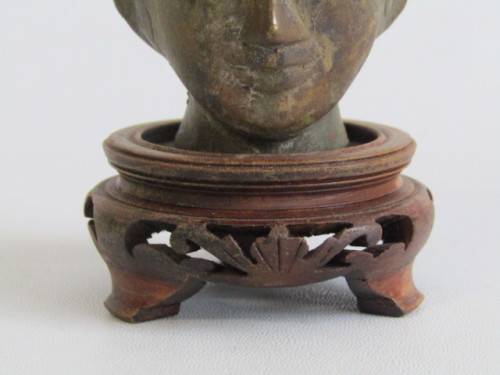Very old Burmese Bronze Buddha Head on wooden Stand in excellent and aged condition, 13cm tall