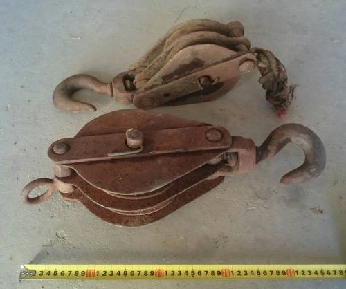 two old steel pulley's