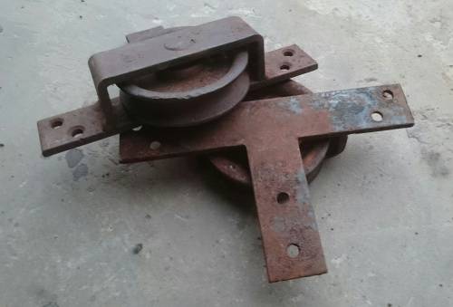 Pair of old steel pulley type wheels