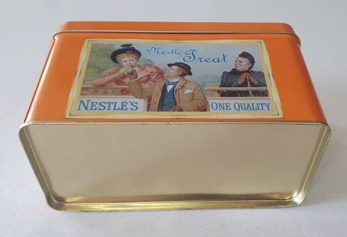 NESTLE tin as per photos