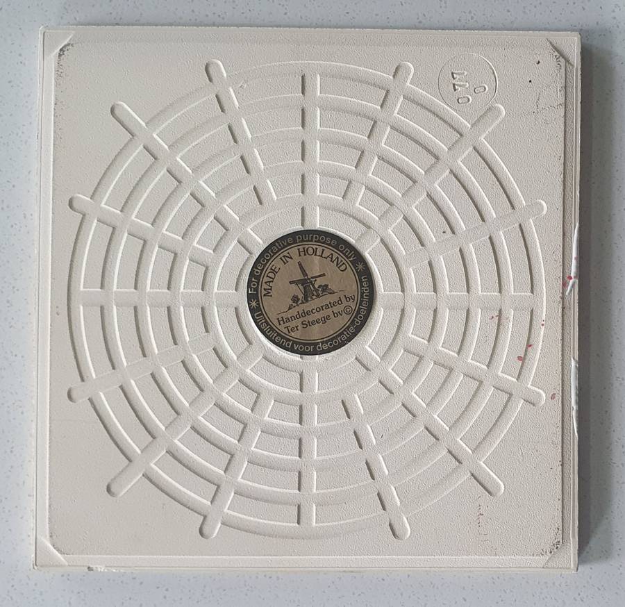 Hand decorated tile - made in Holland as per photo.