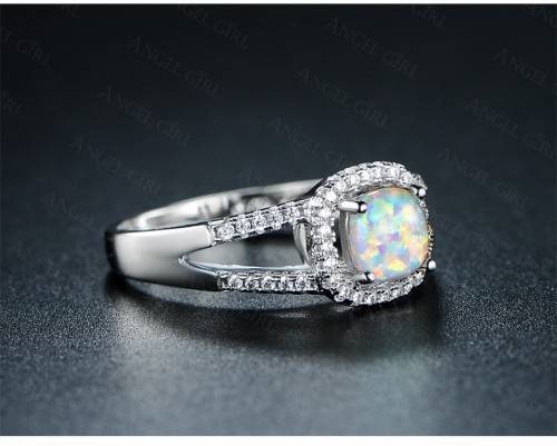 Exquizite Queen ring with simulated Fire Opal and white gold polish