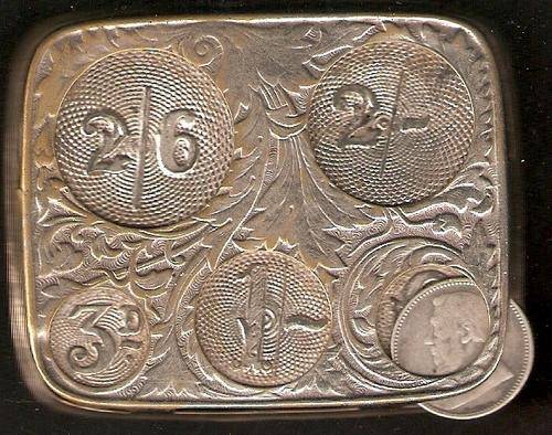 A VERY OLD COIN HOLDER - FROM THE SHILLINGS PERIOD INCLUDING A 1897 ZAR SIXPENCE