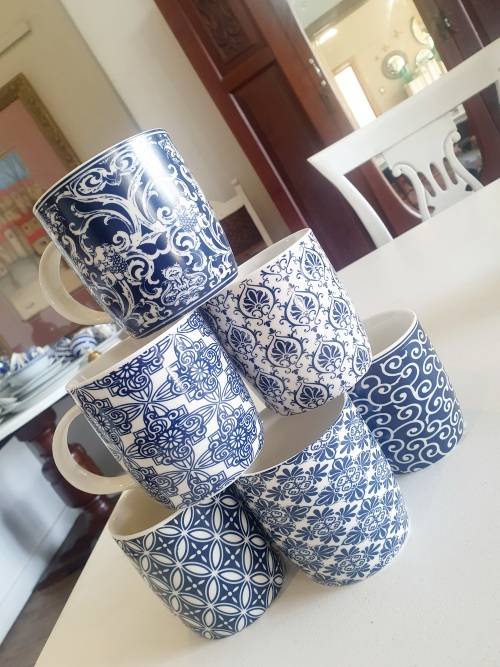 Set of six blue and white mugs