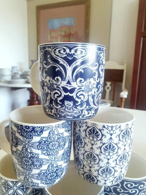 Set of six blue and white mugs