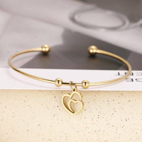 RETAIL PRICE: R 999 Adjustable Titanium "Hearts" Charm Bangle (GOLD )