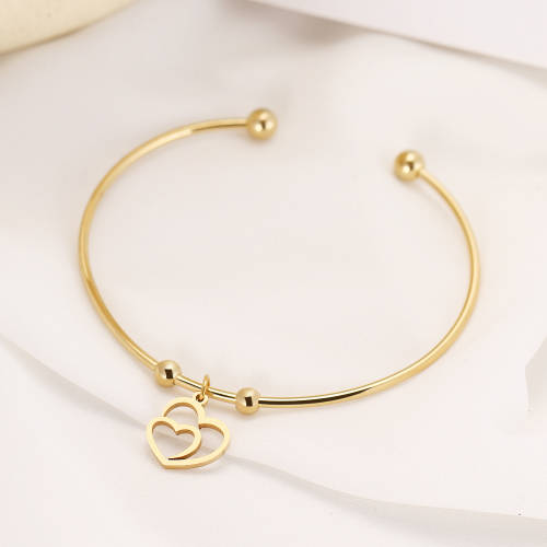 RETAIL PRICE: R 999 Adjustable Titanium "Hearts" Charm Bangle (GOLD )