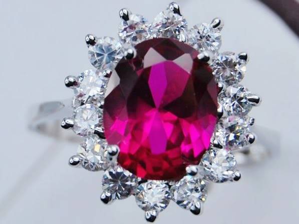 STUNNING PINK QUARTZ SURROUND BY WHITE TOPAZ CZ RING