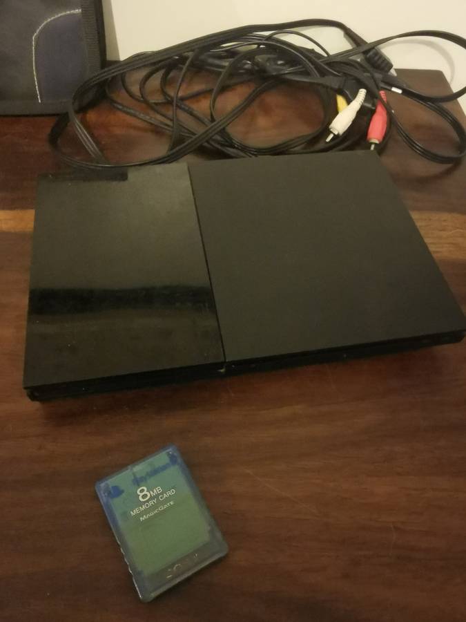 PlayStation 2 with Wireless Remote and Memory Card Including CD Case with 13 Games