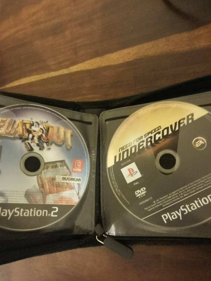 PlayStation 2 with Wireless Remote and Memory Card Including CD Case with 13 Games
